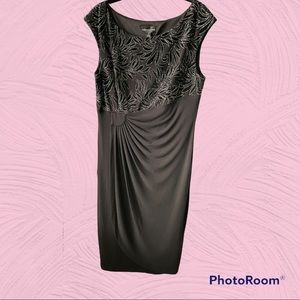 New dress in black with silver accents.